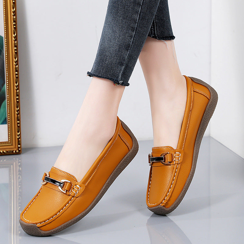 Orange loafers i läder med gulddetaljer för kvinnor