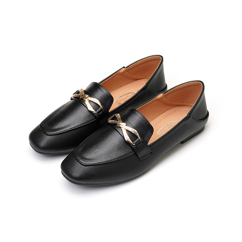 Eleganta svarta loafers med guldrosett för dam