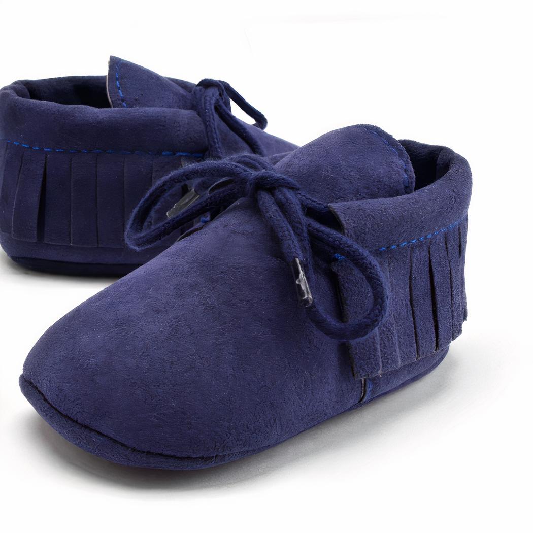 Blå babyloafers med snörning och fransar