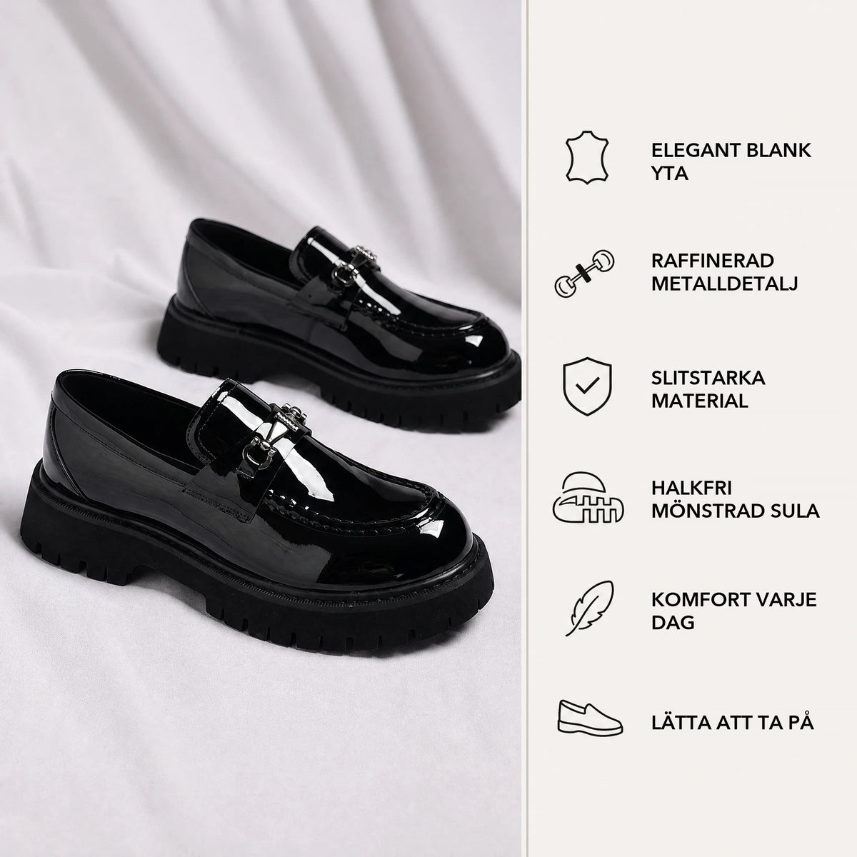 Svarta lackloafers sedda framifrån Bild
